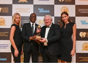 Prime Minister Philip J Pierre receiving award at 30th World Travel Awards