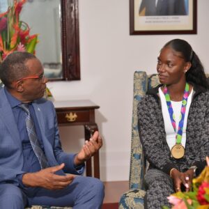 Prime Minister Philip J Pierre with athlete Julian Alfred 